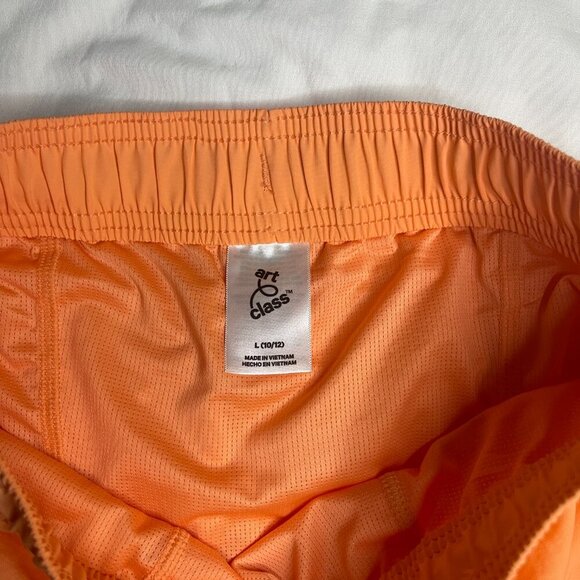 Art class mid-thigh length orange Size L (10/12). Made in Vietnam. 100% Nylon. - Picture 7 of 7